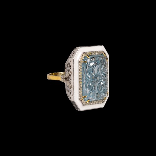 A silver and gold ring with enamel and aquamarine.